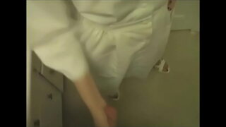 Naughty nurse gives patient a handjob.