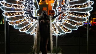 Angel Monika Fox walks naked on the waterfront in Sochi.