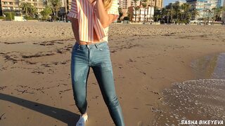 Wet shoot on a public beach with crazy model. Risky outdoor masturbation. Foot fetish. Pee in jeans.