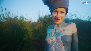 Alternative couple having wild outdoor sex in outdoor hot bath.